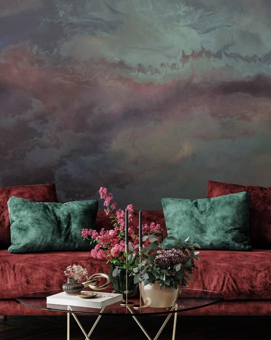abstract patinated wall mural with red sofa