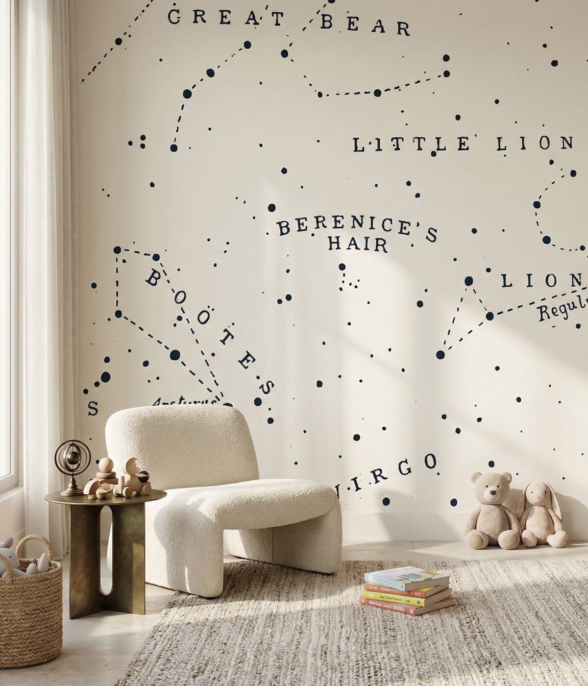 A cozy and educational kids' playroom featuring a large wall mural of star constellations with names like "Great Bear" and "Little Lion" in a classic serif font. The room includes a white bouclé armchair, a small brass side table with wooden toys, and a woven basket filled with plush items. On the floor, a textured jute rug holds a small stack of children's books, while a teddy bear and bunny sit near a wooden bookshelf decorated with string lights.